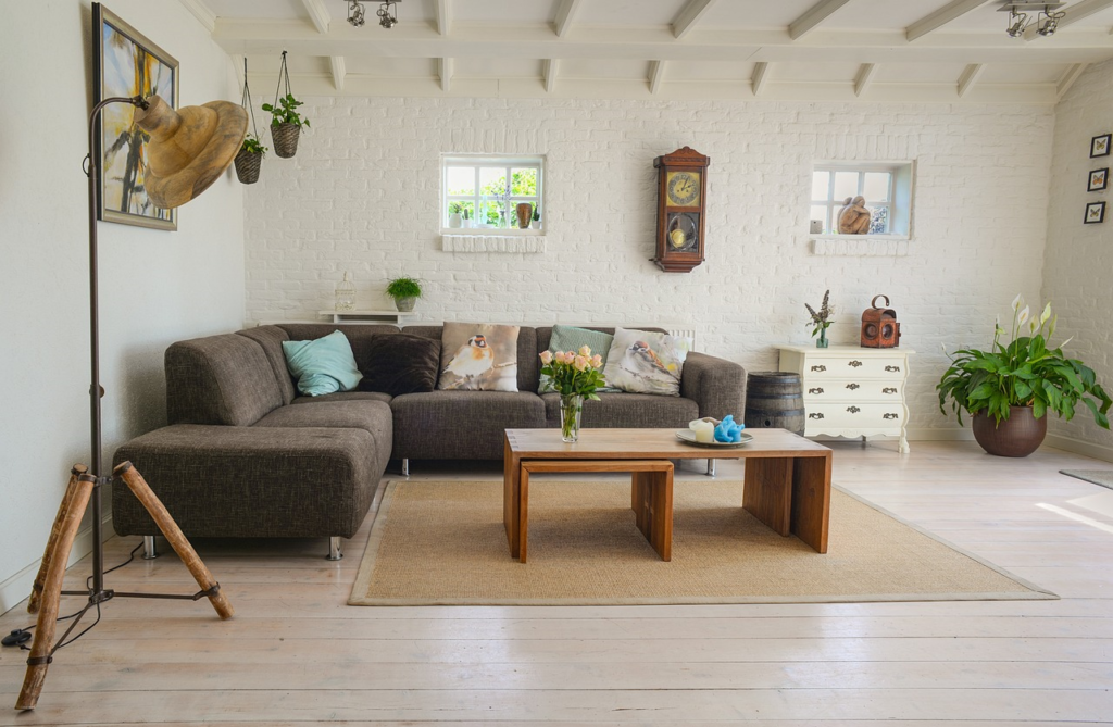 Simple Living Room with Old Chest Drawers and Wall Clock